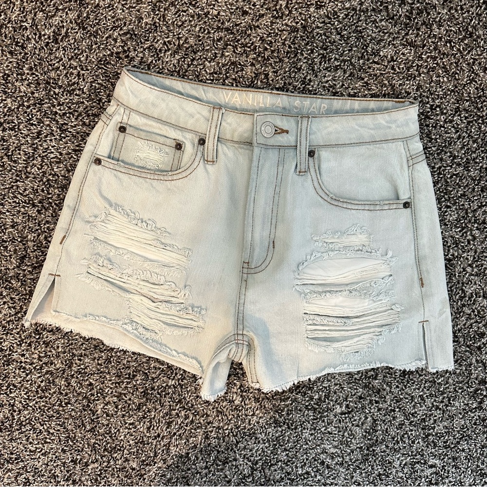 Light wash high rise ripped denim shorts by Vanilla Star